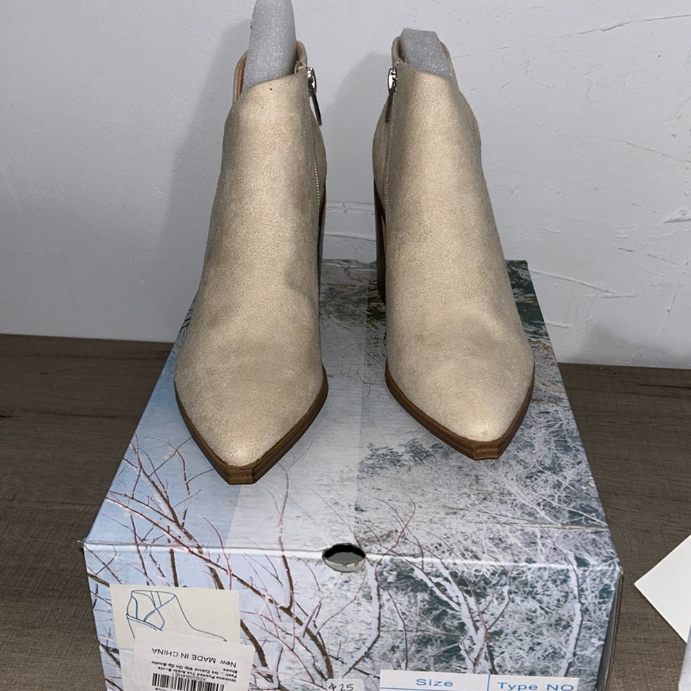48. Cream Slip On Zip Bootie